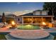 Backyard with a pool and an outdoor kitchen, perfect for nighttime gatherings and relaxation at 339 Carolyn Dr, Oviedo, FL 32765