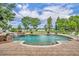 Inviting backyard pool with brick paver patio, perfect for outdoor gatherings and enjoying sunny days at 339 Carolyn Dr, Oviedo, FL 32765