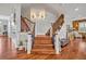 Elegant staircase with wood and iron railings and decorative lighting at 339 Carolyn Dr, Oviedo, FL 32765