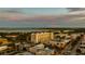 Aerial shot of the building surrounded by city landscape, featuring a tranquil waterfront at 111 E Monument Ave # 801, Kissimmee, FL 34741