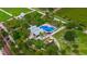 Aerial view of the splashpad, playground, and green space for the community to enjoy at 111 E Monument Ave # 801, Kissimmee, FL 34741