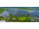 Panoramic aerial view showcasing the waterways, park, and boat dock at 111 E Monument Ave # 801, Kissimmee, FL 34741