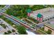 Aerial view of the train station, pedestrian overpass and parking garage at 111 E Monument Ave # 801, Kissimmee, FL 34741