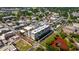 Aerial view of the residence and the surrounding neighborhood, featuring green spaces and walking areas at 111 E Monument Ave # 801, Kissimmee, FL 34741
