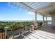 Beautiful balcony with flowers, pergola and pillars overlooking the landscape at 111 E Monument Ave # 801, Kissimmee, FL 34741