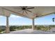 Large outdoor balcony featuring fans and beautiful views of the water and surrounding landscape at 111 E Monument Ave # 801, Kissimmee, FL 34741