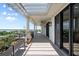 Large outdoor balcony featuring pergola, and views of the water and surrounding landscape at 111 E Monument Ave # 801, Kissimmee, FL 34741