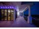 Long covered balcony with outdoor fans, lights, iron railings, and sliding glass doors accessing an elegant interior at 111 E Monument Ave # 801, Kissimmee, FL 34741