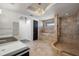 Modern bathroom with dual vanities, a luxurious shower, and a built-in bathtub at 111 E Monument Ave # 801, Kissimmee, FL 34741