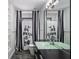 Well-lit bathroom with a large mirror, decorative shower curtain, and epoxy floor at 111 E Monument Ave # 801, Kissimmee, FL 34741