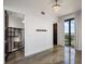 Primary bedroom with balcony doors, epoxy floor, and walk in closet at 111 E Monument Ave # 801, Kissimmee, FL 34741