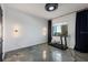Gym room with modern track lighting, epoxy flooring, and a treadmill at 111 E Monument Ave # 801, Kissimmee, FL 34741