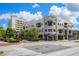 Well-maintained building exterior showcasing architectural details, awnings, and pedestrian access at 111 E Monument Ave # 801, Kissimmee, FL 34741