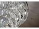 Close-up of a crystal chandelier with intricate details and a modern design at 111 E Monument Ave # 801, Kissimmee, FL 34741