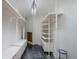 Custom walk-in closet with built-in shelving and drawers, with epoxy floor at 111 E Monument Ave # 801, Kissimmee, FL 34741