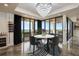 Dining area with a modern chandelier and sliding doors to the balcony with a scenic view at 111 E Monument Ave # 801, Kissimmee, FL 34741