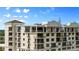 Elegant condo building featuring large windows and inviting balconies at 111 E Monument Ave # 801, Kissimmee, FL 34741
