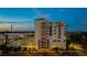Modern condominium building featuring balconies, street-level retail, and convenient parking at 111 E Monument Ave # 801, Kissimmee, FL 34741