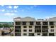 Multi-story condo building with multiple balconies and large windows at 111 E Monument Ave # 801, Kissimmee, FL 34741