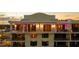 Close up aerial view of the top floors with elegant lighting and balconies of a multi-story building at 111 E Monument Ave # 801, Kissimmee, FL 34741