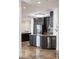 Modern kitchen with black cabinets, stainless steel appliances, and large center island at 111 E Monument Ave # 801, Kissimmee, FL 34741