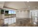 Open floor plan with floor-to-ceiling windows offering scenic views and a decorative wall at 111 E Monument Ave # 801, Kissimmee, FL 34741