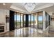 Bright living space with floor-to-ceiling windows offering panoramic views and access to a balcony at 111 E Monument Ave # 801, Kissimmee, FL 34741