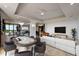 Elegant living room with a game table, plush seating, and a balcony overlooking the city at 111 E Monument Ave # 801, Kissimmee, FL 34741