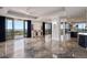 Open living area with floor to ceiling windows leading to a balcony with picturesque city views at 111 E Monument Ave # 801, Kissimmee, FL 34741