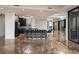 Spacious living area with bar seating and floor-to-ceiling windows for natural light and views at 111 E Monument Ave # 801, Kissimmee, FL 34741