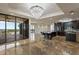 Large living space with kitchen, island seating, and sliding glass doors to the balcony at 111 E Monument Ave # 801, Kissimmee, FL 34741