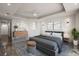 Serene bedroom featuring modern decor, soft lighting, and a decorative geometric wood bureau at 111 E Monument Ave # 801, Kissimmee, FL 34741