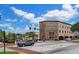 Picturesque town square with attractive building showcasing architectural details and a colorful mural on a clear day at 111 E Monument Ave # 801, Kissimmee, FL 34741