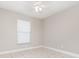 Bedroom with tile floors, ceiling fan, and window at 11715 Sindlesham Ct, Orlando, FL 32837