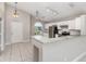 Bright kitchen features white cabinets, stainless steel appliances, and granite countertops at 11715 Sindlesham Ct, Orlando, FL 32837