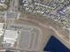 Aerial view showing community homes, streets, parking lot, pond, and surrounding neighborhood at 11802 Pulitzer Pl, Orlando, FL 32832
