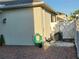 Backyard featuring a brick patio, air conditioner, and convenient hose and water access at 11802 Pulitzer Pl, Orlando, FL 32832