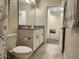 Bathroom featuring neutral walls, tile floors, and a vanity with granite countertops at 11802 Pulitzer Pl, Orlando, FL 32832