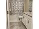 Bathroom featuring tile floors, a tub with a decorative shower curtain, and a vanity with granite countertops at 11802 Pulitzer Pl, Orlando, FL 32832