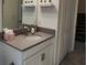 Modern bathroom featuring a single sink vanity with a gray countertop and stylish fixtures at 11802 Pulitzer Pl, Orlando, FL 32832