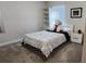 Bright bedroom featuring neutral walls, carpet floors, and a white bed frame at 11802 Pulitzer Pl, Orlando, FL 32832
