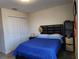 Cozy bedroom with dark wood furniture and closet at 11802 Pulitzer Pl, Orlando, FL 32832