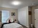 Bright bedroom featuring neutral walls, carpet floors, and a closet at 11802 Pulitzer Pl, Orlando, FL 32832