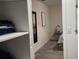 View into a walk-in closet featuring shelving and access to the bedroom at 11802 Pulitzer Pl, Orlando, FL 32832