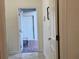 Inviting hallway view of a bright and welcoming entryway with neutral color palette at 11802 Pulitzer Pl, Orlando, FL 32832
