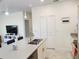 Bright kitchen with quartz countertops, stainless steel appliances, and a large island at 11802 Pulitzer Pl, Orlando, FL 32832