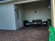 Covered brick patio featuring outdoor seating and a peaceful, private area to relax at 11802 Pulitzer Pl, Orlando, FL 32832