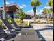 Resort-style pool with lounge chairs, tropical plants, and outdoor dining area at 11802 Pulitzer Pl, Orlando, FL 32832