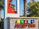The Storey Park community sign features colorful icons on a stone and concrete base at 11802 Pulitzer Pl, Orlando, FL 32832
