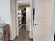 Spacious walk-in closet with built-in shelving for ample storage and organization at 11802 Pulitzer Pl, Orlando, FL 32832